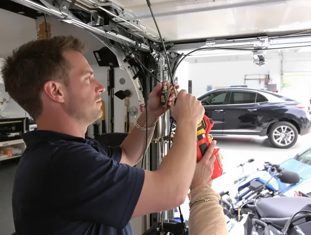 Redondo Beach Garage Door Repair safety certified technician performing cable replacement in Redondo Beach